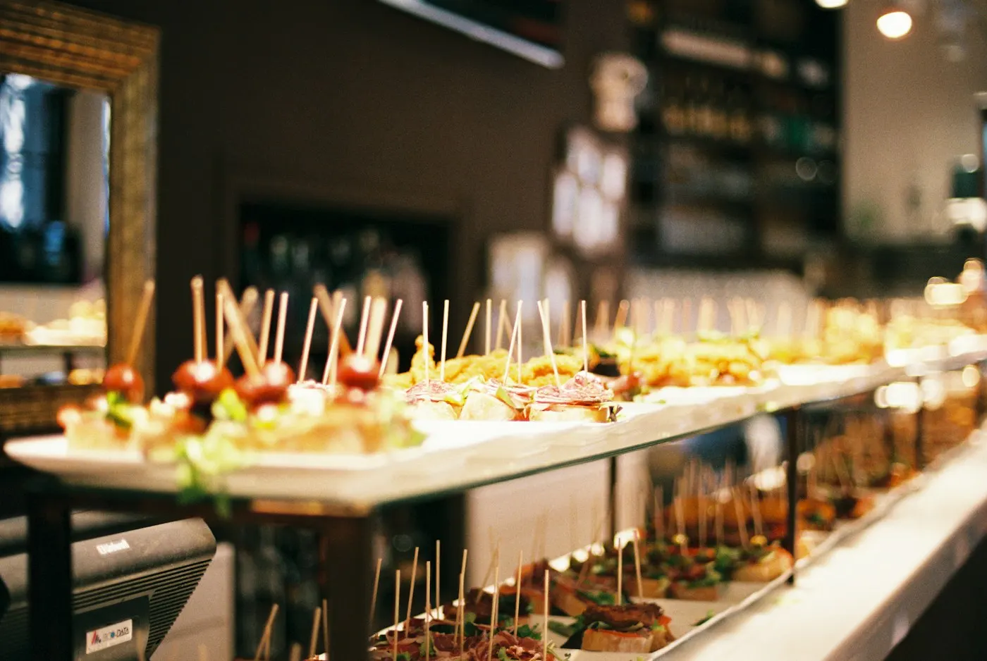 Long counter of bite-sized canapés at an event